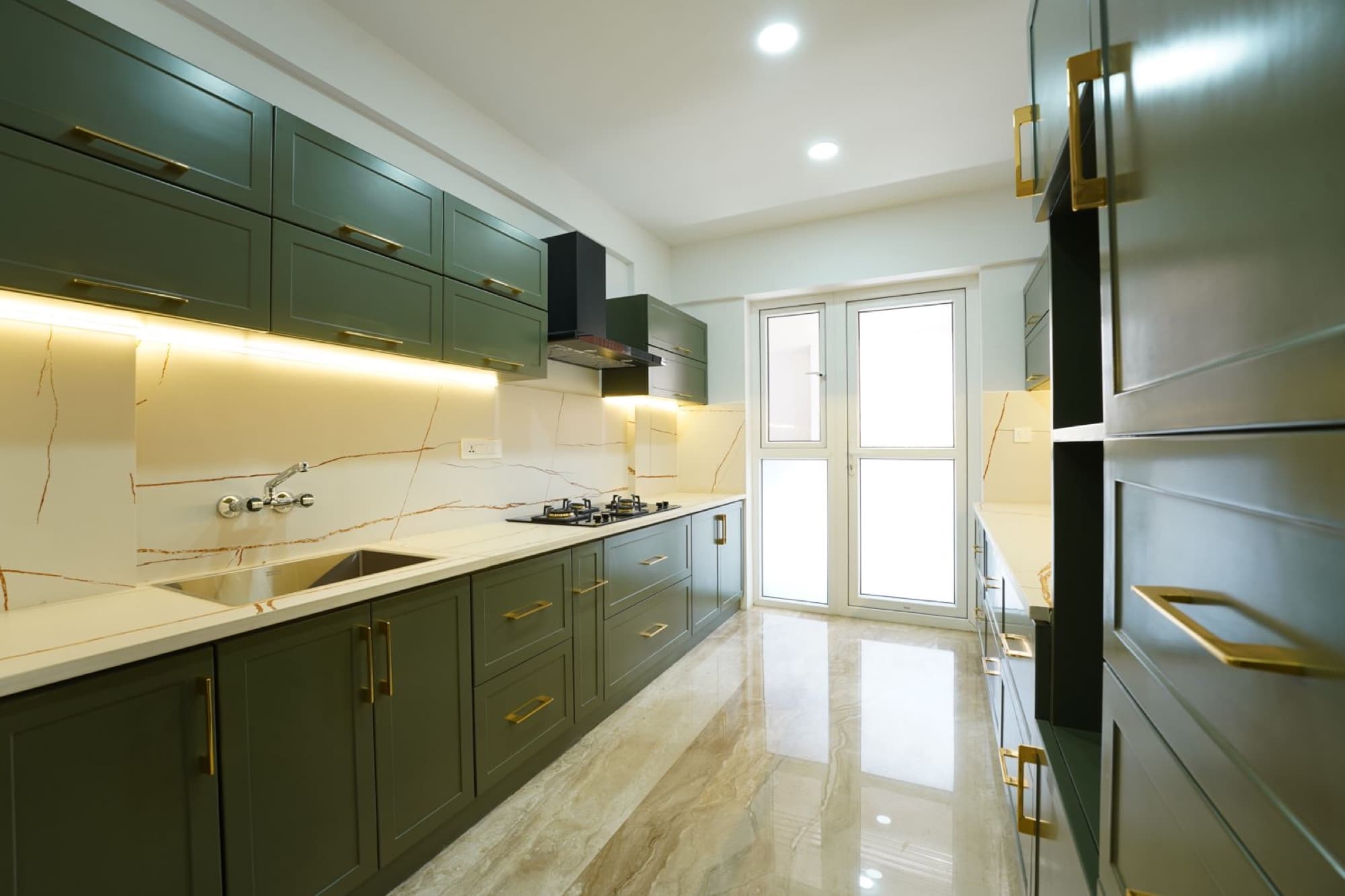 Kitchen with green cabinetry